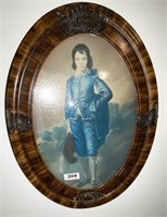 boy in blue suit print in oval frame