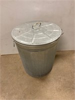 Small galvanized garbage can. 18” tall