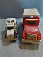 Two toy trucks one is a Tonka ambulance. Very