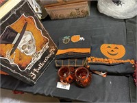 Halloween towels, candle holders, box.