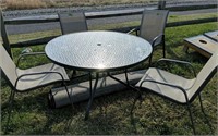 48" Green Patio Table Four Chairs. Outdoor Rug. On