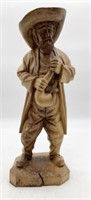 Carved Wooden Man Playing an Instrument