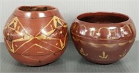 2 pieces of decorated U.N.D pottery 4" tallest