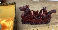 Carved resin dragon boat with immortals