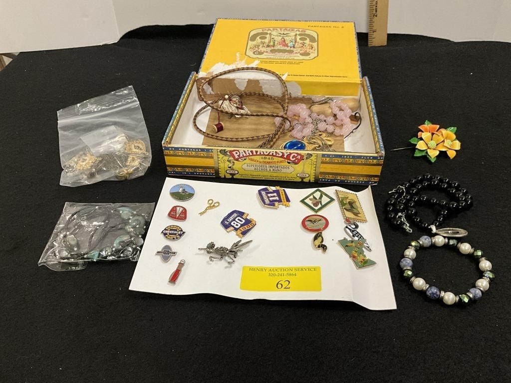 Pins, jewelry and cigar box