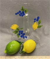 Glass, lemon, and lime with glass tray