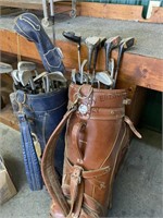 2 bags of men's golf clubs