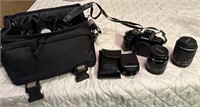 cannon camera with accessories and bag