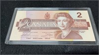 1986 Canadian 2 Dollar Bill In Hard Plastic Case