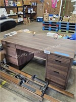 wooden office desk with keys