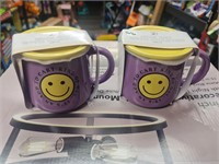 2 coffee mugs with coasters
