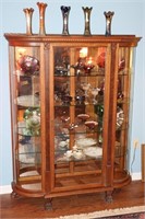 Bow front china cabinet with claw feet and mirror