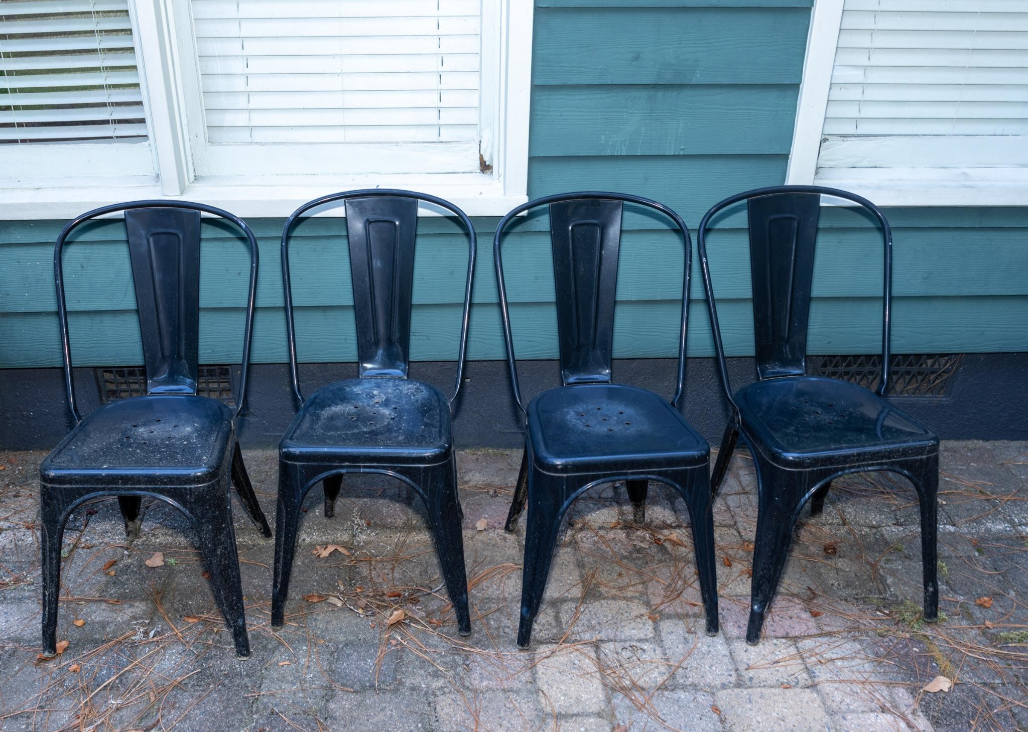 Set of four contemporary metal dining chairs as is