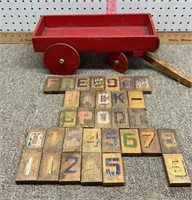 Vintage wooden wagon and wooden children’s blocks