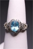 STERLING OVAL CUT BLUE TOPAZ RING, LAB GROWN