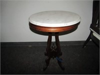 Marble top oval table.