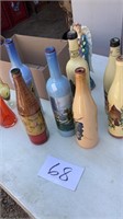 Seven decor painted bottles, five vases and one