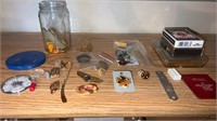 Shelf of miscellaneous items  pins , playing