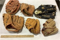 6 baseball gloves