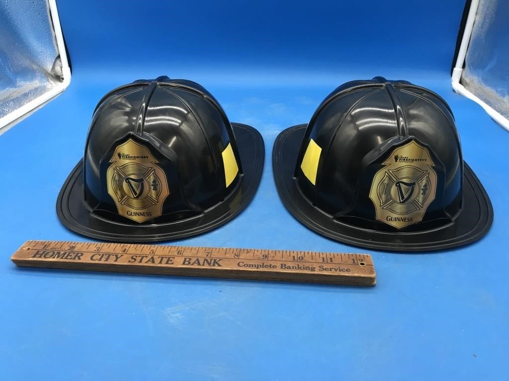 Pair of Plastic Guinness Fire Helmets