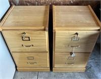 2 wooden filing cabinets.