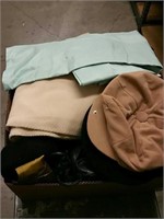 Box of fabrics and hats