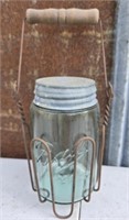 Glass ball jar with iron holder