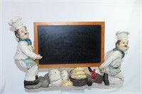 Chefs Carrying a Blackboard