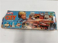 Hot Wheels City, in the box. Has been played with