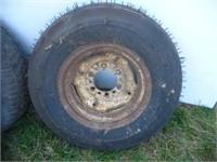 7.60 - 15 SL unused tire on C.I. rim