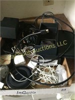 assorted phone elecronics ear buds chargers
