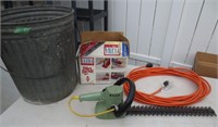 Electric hedge trimmer, extension cord, trash can