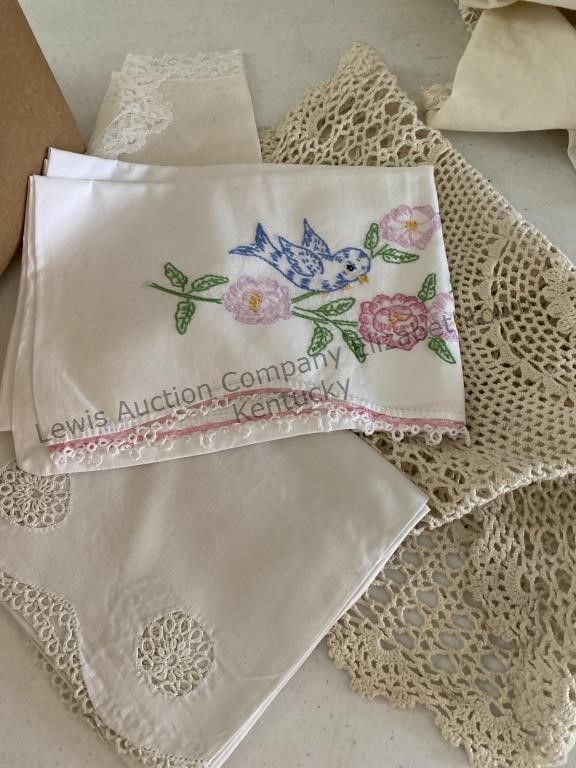 Box of table scarfs, doilies embroidered