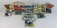 (8) PACKAGES OF  MARBLES & SHOOTERS