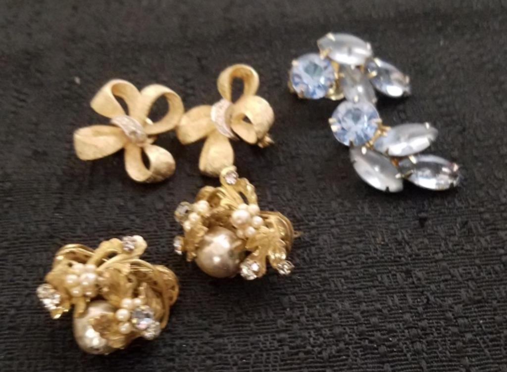 Three vintage clip-on earrings one is stamped