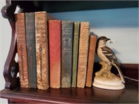 EARLY LEATHER BOOKS WITH MOCKINGBIRD FIGURINE