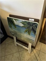 Two TV trays - one with beach scene