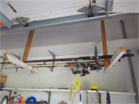 Five Fishing Rods Hanging Above Garage