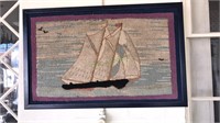 Antique hook rug of a clipper ship that is