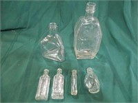 6 clear glass bottles