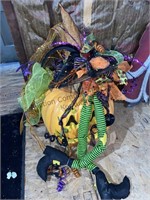 Large pumpkin and witch Halloween decorations