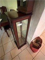 Small curio cabinet with glass shelves