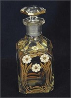 Decorated 5 1/2" cologne bottle, small chip on