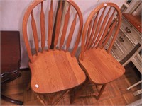 Two swivel oak bar stools, 43" high