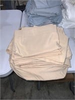 two sets of beige twin size sheets