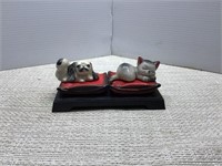 Napoco cats on a pillow on a tray holder