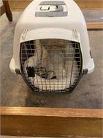 Pet carrier with bed inside