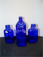 4 Genuine Phillips cobalt blue glass bottles