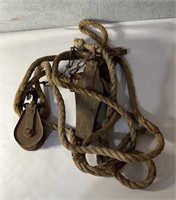Antique metal pulleys and rope