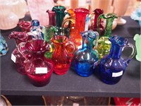 16 pieces of colored crackle glass, all pitchers